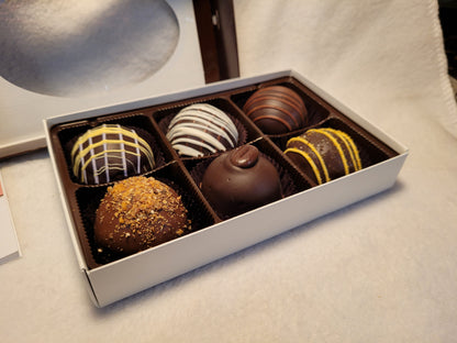 Box of assorted chocolate truffles with a Northwest Fudge card 