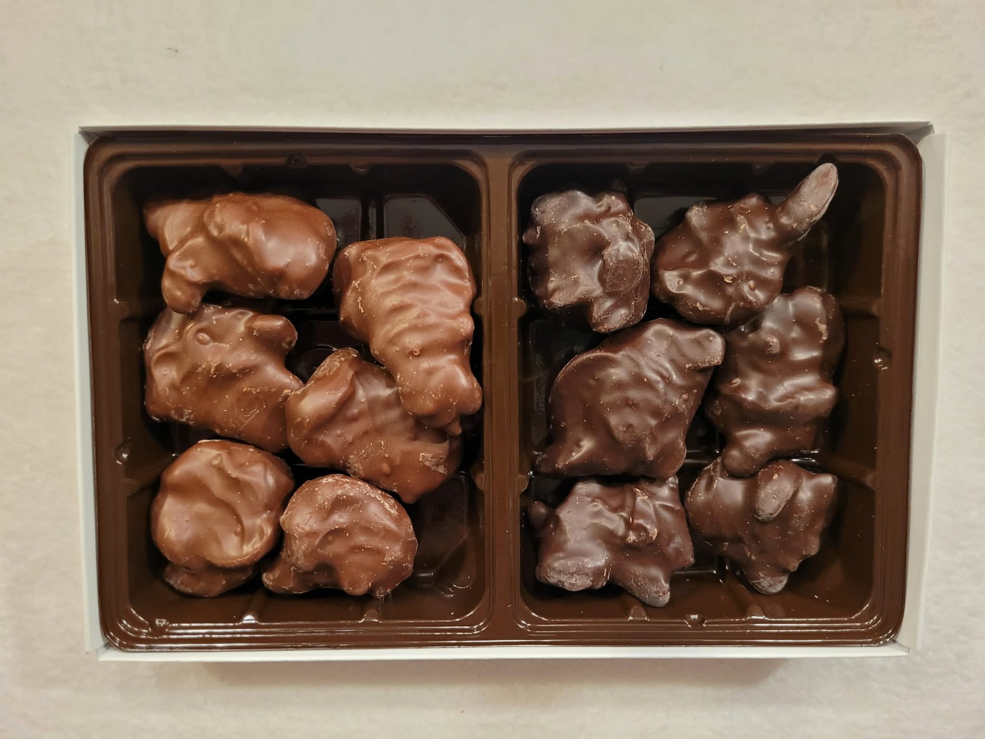 Chocolate covered Cashew Clusters in Milk and Dark chocolate in a gift box.